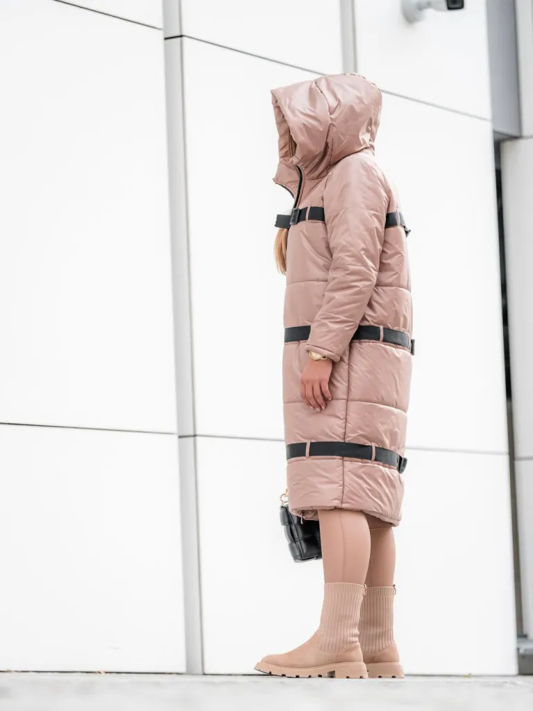 Beautiful women's coat with ribbons, zipper fastening and a hood.