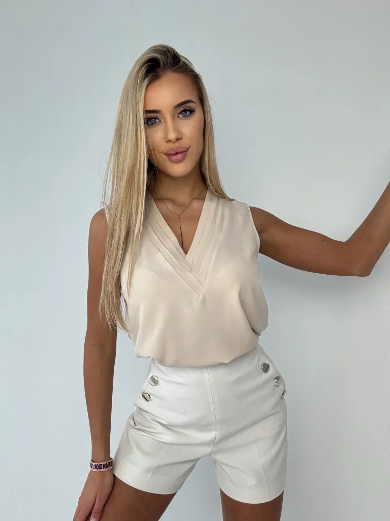 Elegantná dámska blúzka s ozdobným výstrihom, bez rukávov