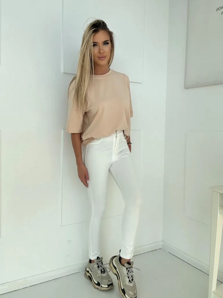 Damenleggings mit Reißverschluss und verdecktem Druckknopfverschluss.
